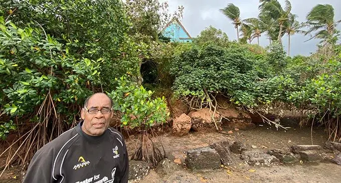 Josateki Vakacereivalu at the hillside where landslides often occur. Part of the church’s rooftop could be seen from the hillside on July 2, 2022. Photo: Josefa Babitu 