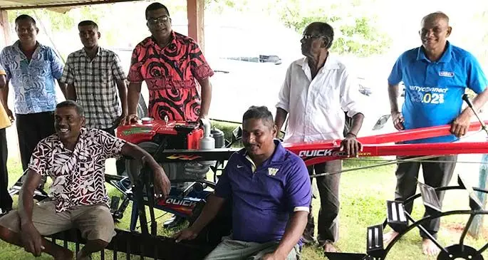 Minister for Agriculture, Waterways and Environment Mahendra Reddy (third from left,) with rice farmers during the handing over of power tiller machine at Laqere in Labasa on April 28, 2020. Photo: Shratika Naidu