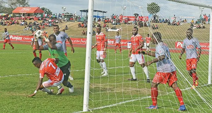 Veteran Farmtrac Tractors Labasa goalkeeper Simione Tamanisau makes a save against Rewa striker Abbu Zahid during the Punjas Battle of the Giants final at Churchill Park, Lautoka, on September 4, 2022. Labasa won 2-1 and Tamanisau received the Golden Glove Award. Photo: Waisea Nasokia.