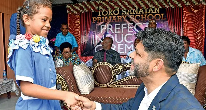 Attorney-General Aiyaz Sayed-Khaiyum with one of the newly badged prefects of Toko Sanatan Primary School on May 5, 2022.  Photo: DEPTFO News