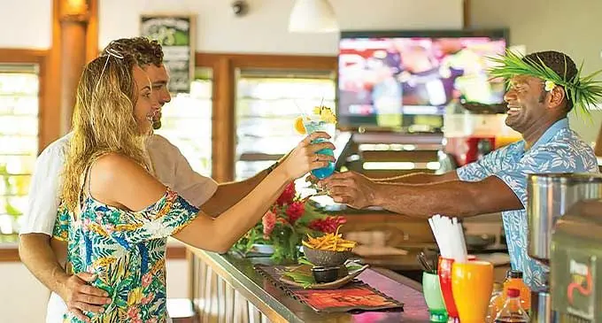 A couple enjoy themselves at the bar at Yatule Resort & Spa.