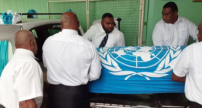Members of the Fiji United Nations Association with the casket of the late Seniloli Tabuatausole. The funeral will be held today. Photo: Simione Haravanaua