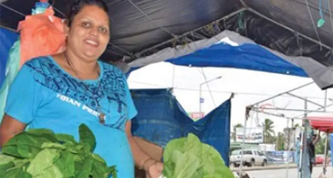 Market vendor Seema Sami sells her produce at the temporar sheds in Nakasi