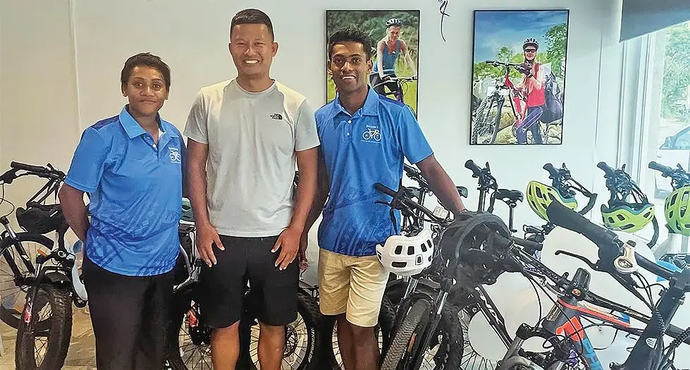Bicycles Fiji employes Ana Ramadigi, Kai (left) and Taione Veiqaravi flank Transportation PTE Limited director Kai Wang. Photo: Waisea Nasokia