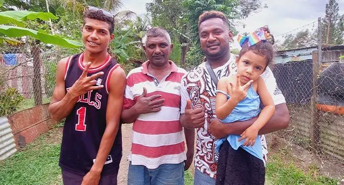 From left: Inoke Qaranivalu, Mohammed Ashref and Saukarasa Ravinasaga holding his three-year-old daughter, Remivani Ravinasaga at Tomuka, Lautoka on August 14, 2022. Photo: Nicolette Chambers