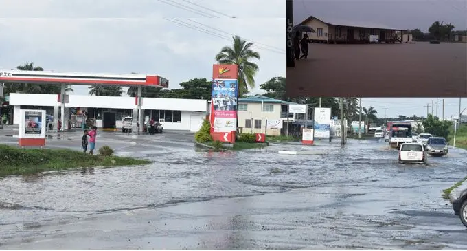 Vehicles try to cross the flooding in Nadi on February 16, 2018. INSET: A flooded Lomawai Village. Photo: Waisea Nasokia