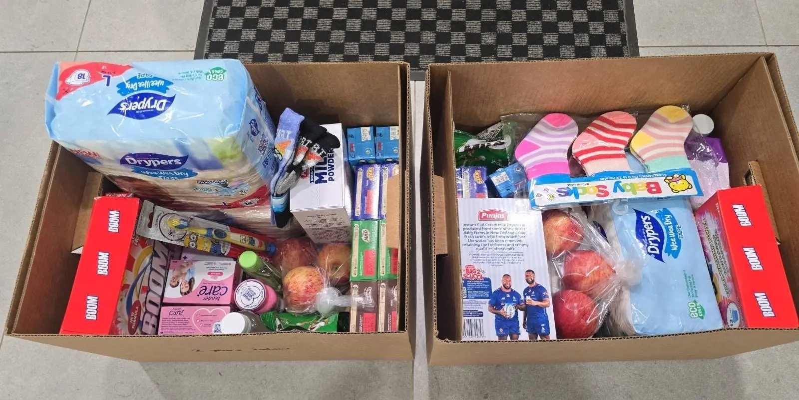 Each box contained diapers, baby powder, bathing soap, milk, cereals, Milo, coconut oil and baby wipes — basic items many families struggle to afford while caring for hospitalised children.