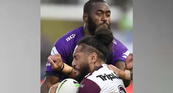Melbourne Storm’s Isaac Lumelume makes a tackle against Manly Sea Eagles at Sunshine Coast Stadium, Queensland in Australia on August 31, 2020. Photo: Storm