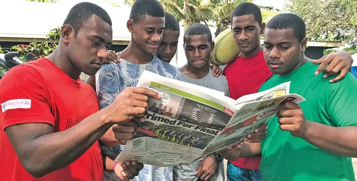 Members of the Queen Victoria School Under-18 rugby team read the Fiji Sun in Sigatoka on August 2,2019. Photo: Waisea Nasokia
