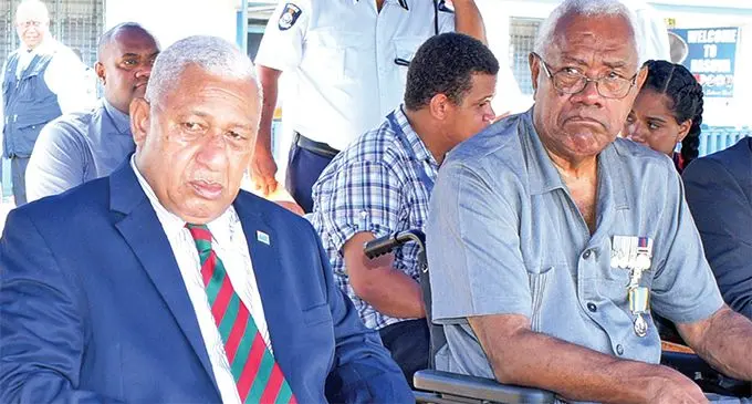 Prime Minister Voreqe Bainimarama with retired Acting Police Commissioner Jim Koroi after awarding him with the long service medal during the medal parade at Nasova ground on April 15, 2019. Photo: Ronald Kumar.