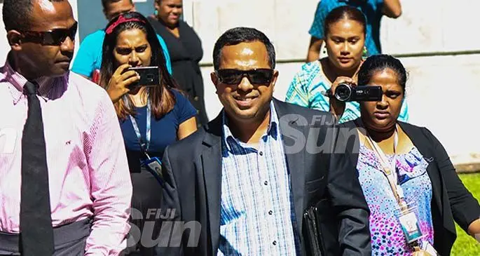 Former Fijian Holdings Limited chief executive officer, Mohammed Nouzab Fareed, widely known as Nouzab Fareed (front, right) outside the Magistrates Court in Suva on January 29, 2020. Photo: Kelera Sovasiga