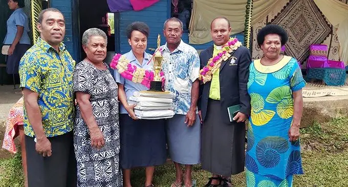 From left: Saqani High School vice principal Jimilai Qaranivalu, Losavati Sovivi (Dux’s mother), Sereana Leleimacuata (Dux), guardian Setareki Niumataiwalu, school chaplain Reverend Savu Lakoenavuli, and Losana Valeselei (aunt) at the annual prize giving ceremony on December 1, 2020. Photo: Saqani High School