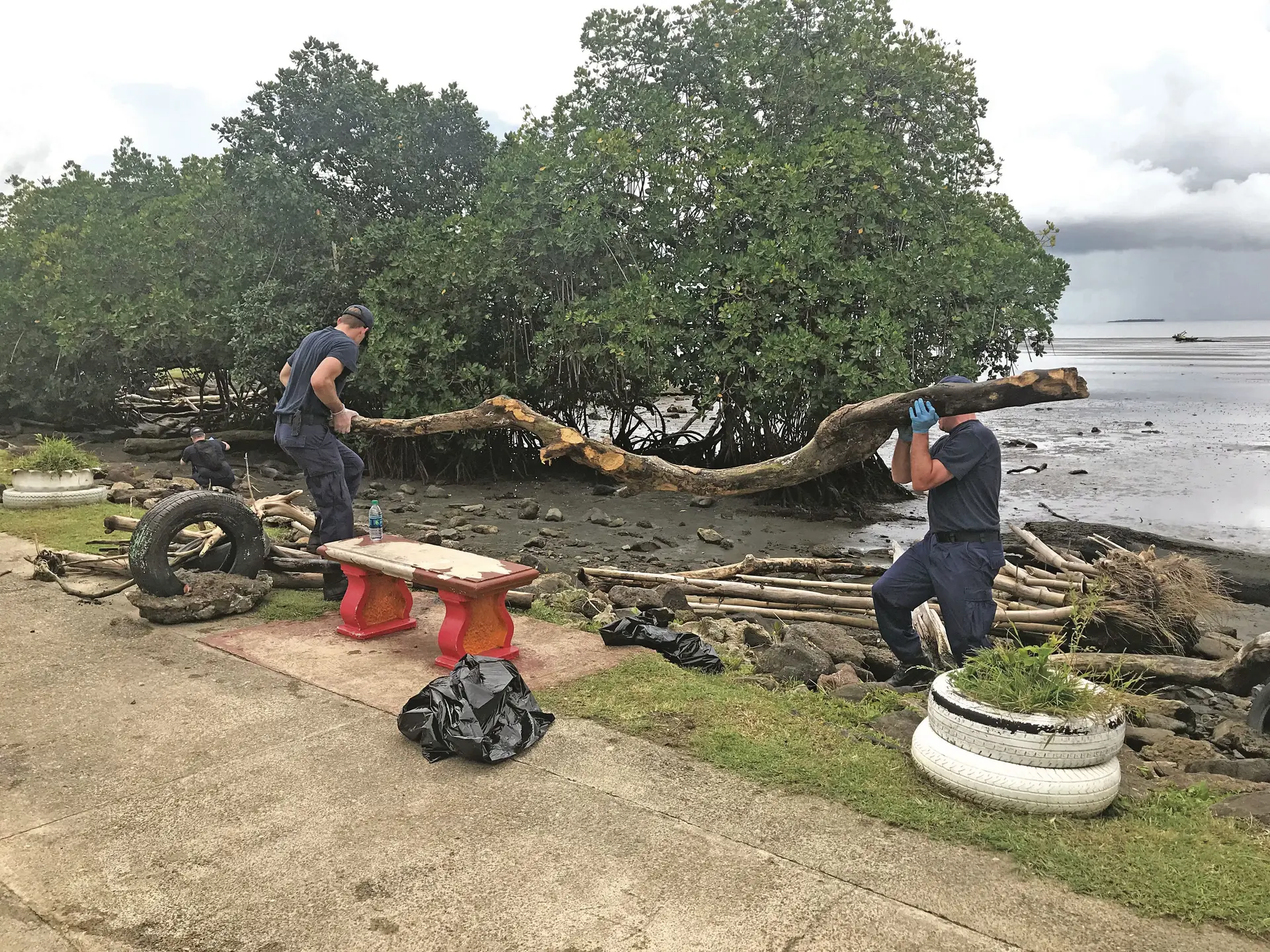 Polar Star crew members cleaning up debris at My Suva Park on February 28, 2018. Photo: Nacanieli Tuilevuka