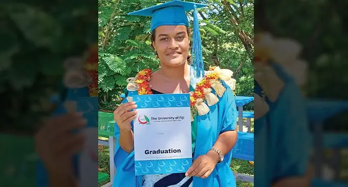 University of Fiji Bacehlor of Science graduate Chloe Zipporah Puamau Mitchell holds up her certificate December 16, 2022, at the Saweni, Lautoka campus after the graduation ceremony. Photo: Salote Qalubau