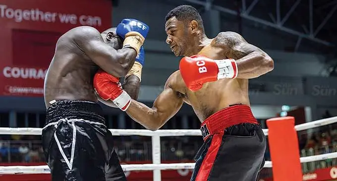 Alifereti Kauyaca (right) throws a left to Joseph Kwajo during their cruiserweight title fight at the Bluewater Boxing Promotion at the Vodafone Arena, Suva on March 2, 2024. Photo: Leon Lord
