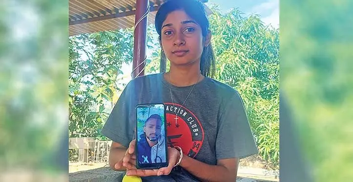 Nehansho Jiya Chand holds up a photo of her fiancé the late Kritesh Rahul Achari at Buabua, Lautoka, on July 6, 2023. Photo: Salote Qalubau