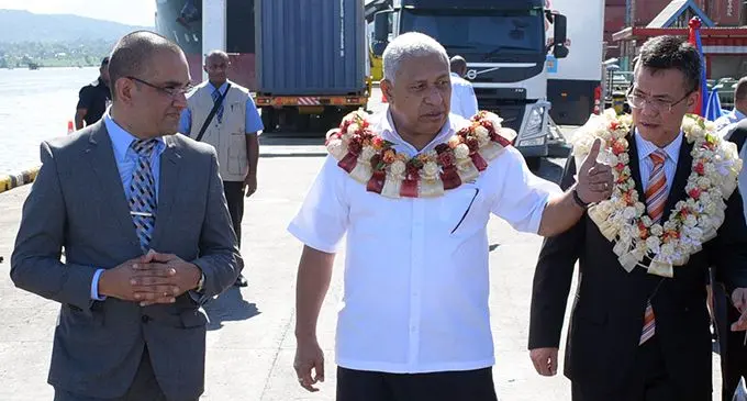 From left: Fiji Revenue and Customs Service chief executive officer Visvanath Das, Prime Minister Voreqe Bainimarama and Chinese Embassy Political Councilor Huang Xuehu following the commissioning of the latest  non-intrusive inspection X-ray technology (background) at the Kings Wharf in Suva on June 12, 2019.  Photo: Ronald Kumar