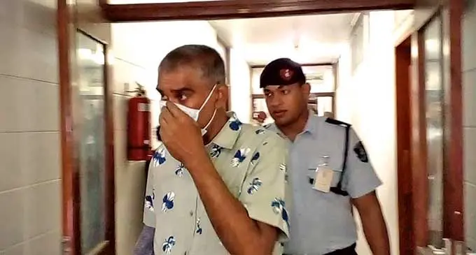 Ajay Kumar is escorted to the High Court in Lautoka on April 6,2022.  Photo: Salote Qalubau