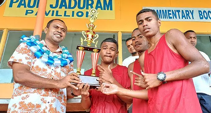 Ministry of Education Labasa adviser Salesi Delai (left) hands over the overall winner’s title to Saint Mary’s Primary School students at Subrail Park, Labasa, on November 6, 2024. Photo: Shratika Naidu