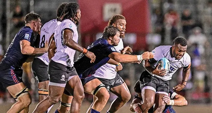 Flying Fijians centre Inia Tabuavou (with ball) on the attack against USA in the Pacific Nations Cup semi-final at Prince Chichibu Memorial Stadium, Tokyo, Japan on September 14, 2024. Photo: AFP