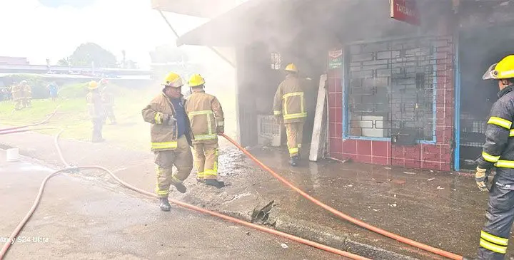 National Fire Authority firefighters attempt to extinguish the fire on April 6, 2025.
