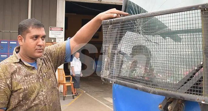 Shore  buses driver, Prasheel Prakash shows the damage to bus windscreen from the stone thrown by young children on November 7, 2019. Photo: Ronald Kumar.