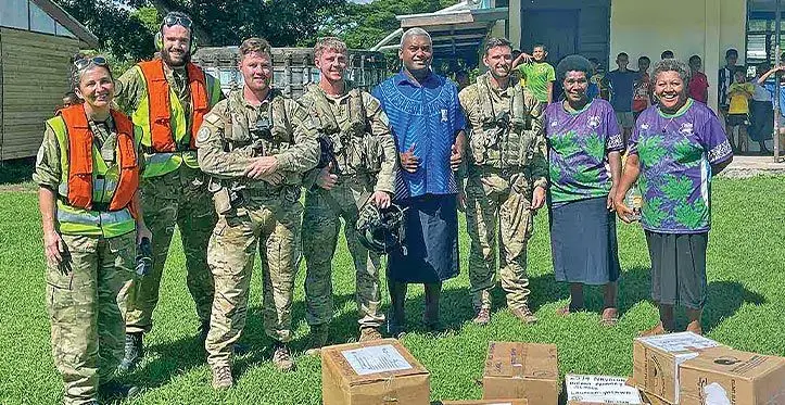Corporal Janice Bond, left, Leading Aircraftman Jared Fairburn-Smith, Corporal Jarrod Milligan, Sergeant Tom Hanson, and Flight Lieutenant Hamish Park of the No. 3 Squadron pose with Nagalevu Ravuama of the Western Commissioner’s office and teachers of Ratu Filimoni School. Photos: Ravuama Nagalevu of Western Commissioners Office