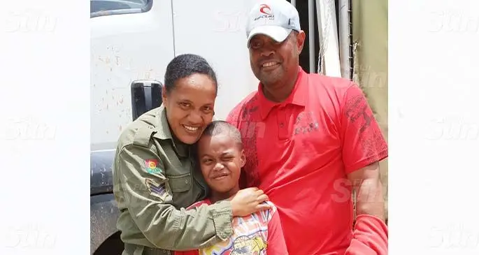 Republic of Fiji Military Forces Sergeant Akanisi Takala with her husband, Kaminioni Takala and son Malakai Takala. Photo: Nicolette Chambers