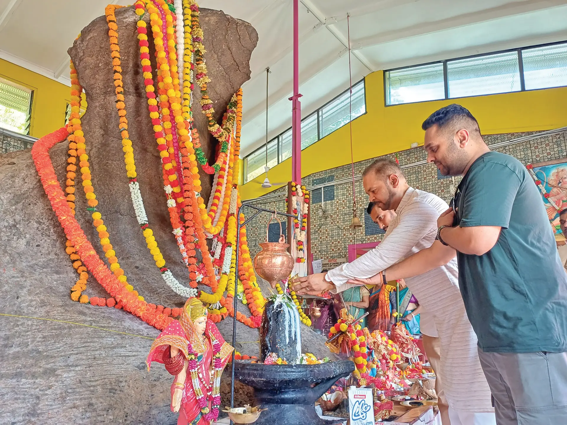 Far right - Cliff Prasad, Gyaneshwar Prasad and Nilesh Raj offering devotion during the Naag Panchami celebration at Nagigi Naag mandir in Labasa on August 17, 2026