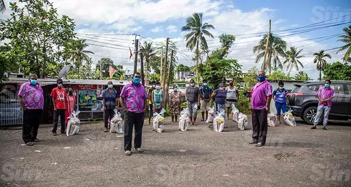 Members of the Nadawa Ramayan Mandali distributing food rations at Mamas Place in Caubati. (Front row, from left (in purple) ) Ram Lingam, Rajnesh Lingam, James Swamy and Rohit Lingam on May 28, 2021. Photo: Leon Lord