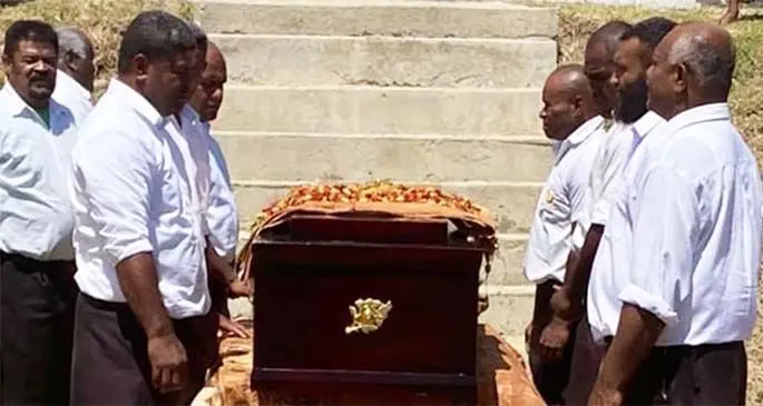 Pallbearers pay their last respects.