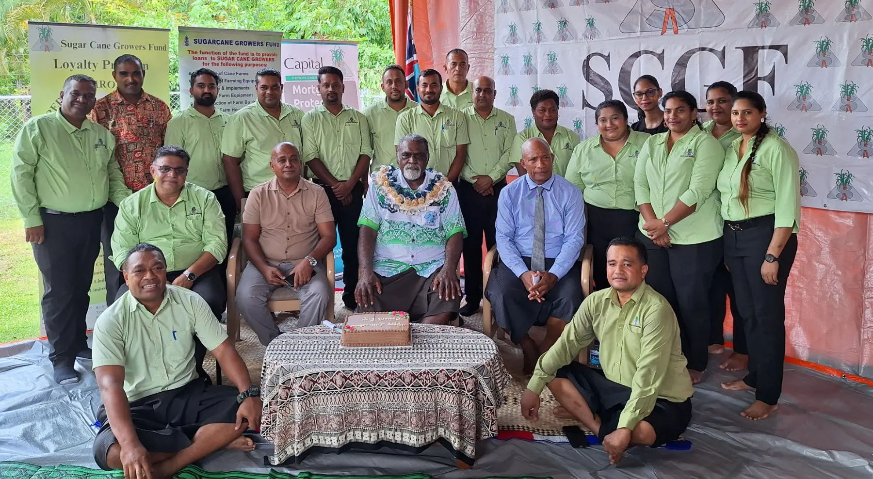 Minister for Agriculture, Waterways and Sugar Industry Tomasi Tunabuna (wearing garland), with the staff at the Sugar Cane Growers Fund in Lautoka. 