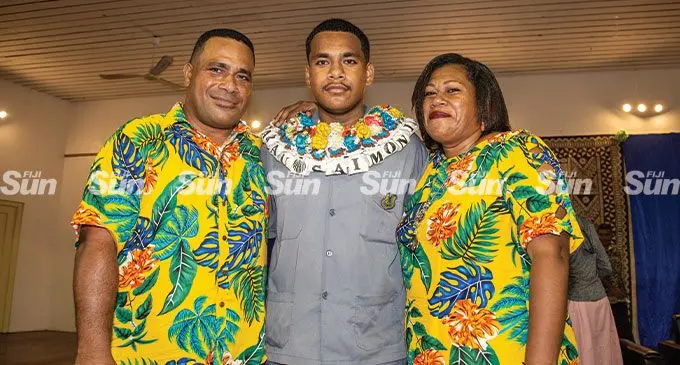Suva Grammar School head boy Saimoni Sarau Junior (middle) flanked by his parents Saimoni Sarau senior (left) and Lia Lagilagi (mother) after the school prefect induction at Nasese on April 29, 2022. Photo: Leon Lord