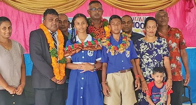 Qawa Primary School head boy Aryan Prasad and head girl Kisha Lingam with invited guests, parents and teachers in Labasa on March 9, 2023.