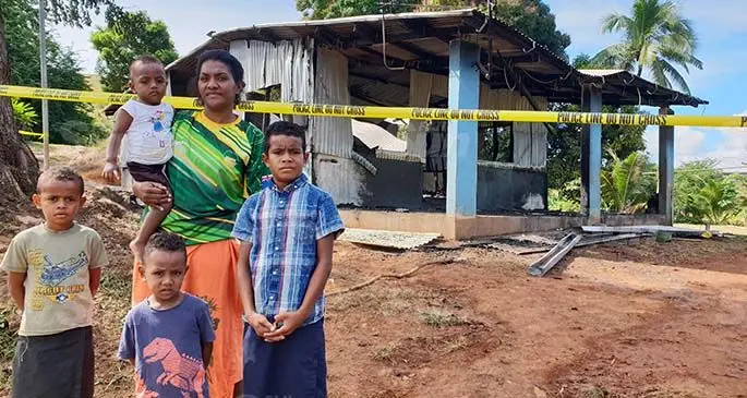 Family members stand in front of their home which was destroyed in a fire. From left: Sanaila Vodre, Saint John Qavili, Vani Godro holding baby Josua Tuisova and Sakiusa Likuveiqali at Matawalu Village in Lautoka on July 5, 2020. Photo: Nicolette Chambers