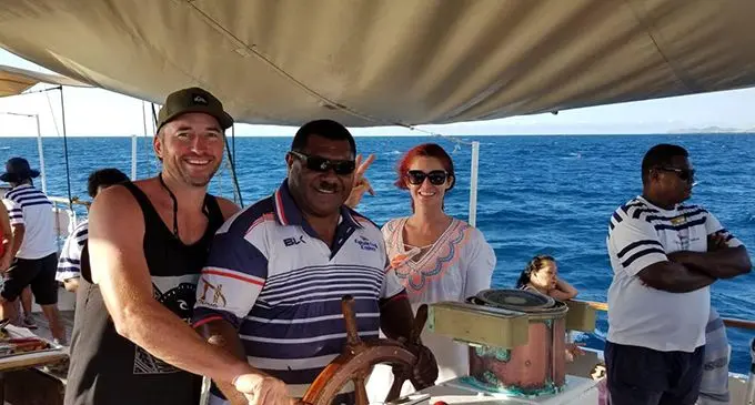 Guests with Captain Cook Cruises Fiji’s Captain Saiasi Koroi on board the The Spirit of the Pacific. Photo: Maraia Vula