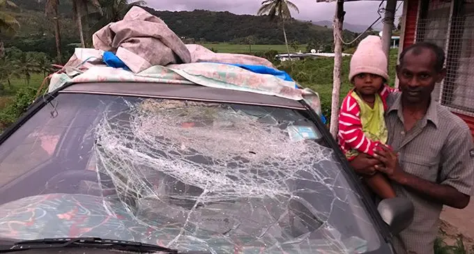 Ram Krishna with his daughter, Manisha Krishna, look at the damages done on his car at Benau, Labasa on May 20, 2019.  Photo: Shratika Naidu