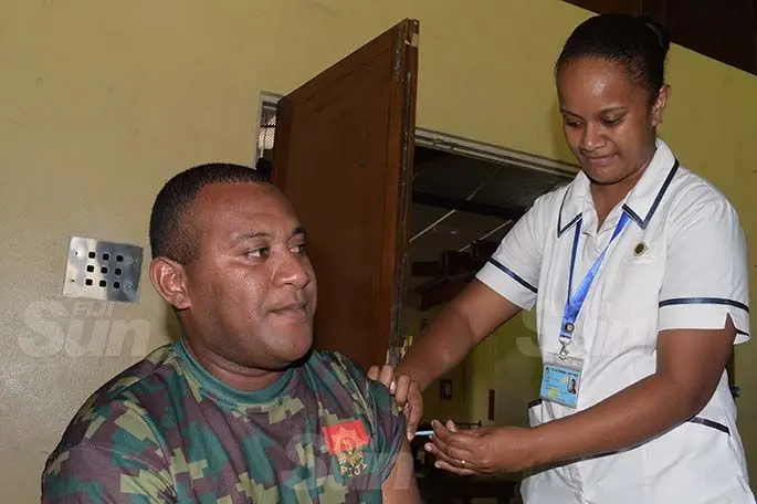 Setefano Koroivalu of RFMF gets his first COVID vaccination shot from staff nurse, Aqela Susu at Queen Elizabeth Barracks, in Nabua, on April 6, 2021. Photo: Ronald Kumar