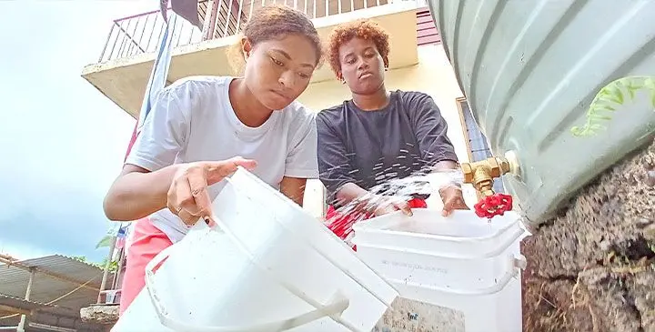 Akanisi Ledua and Grace Dakuna of Rogovoka Delainavesi, Lami filling their bucket of water from a tank as they had water cuts on March 25, 2025. Photo: Ronald Kumar