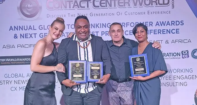 Customer care representatives Sefanaia Silimaibau (second from left) and Doreen Lakhan(fourth from left) while receiving their awards in Bali, Indonesia.