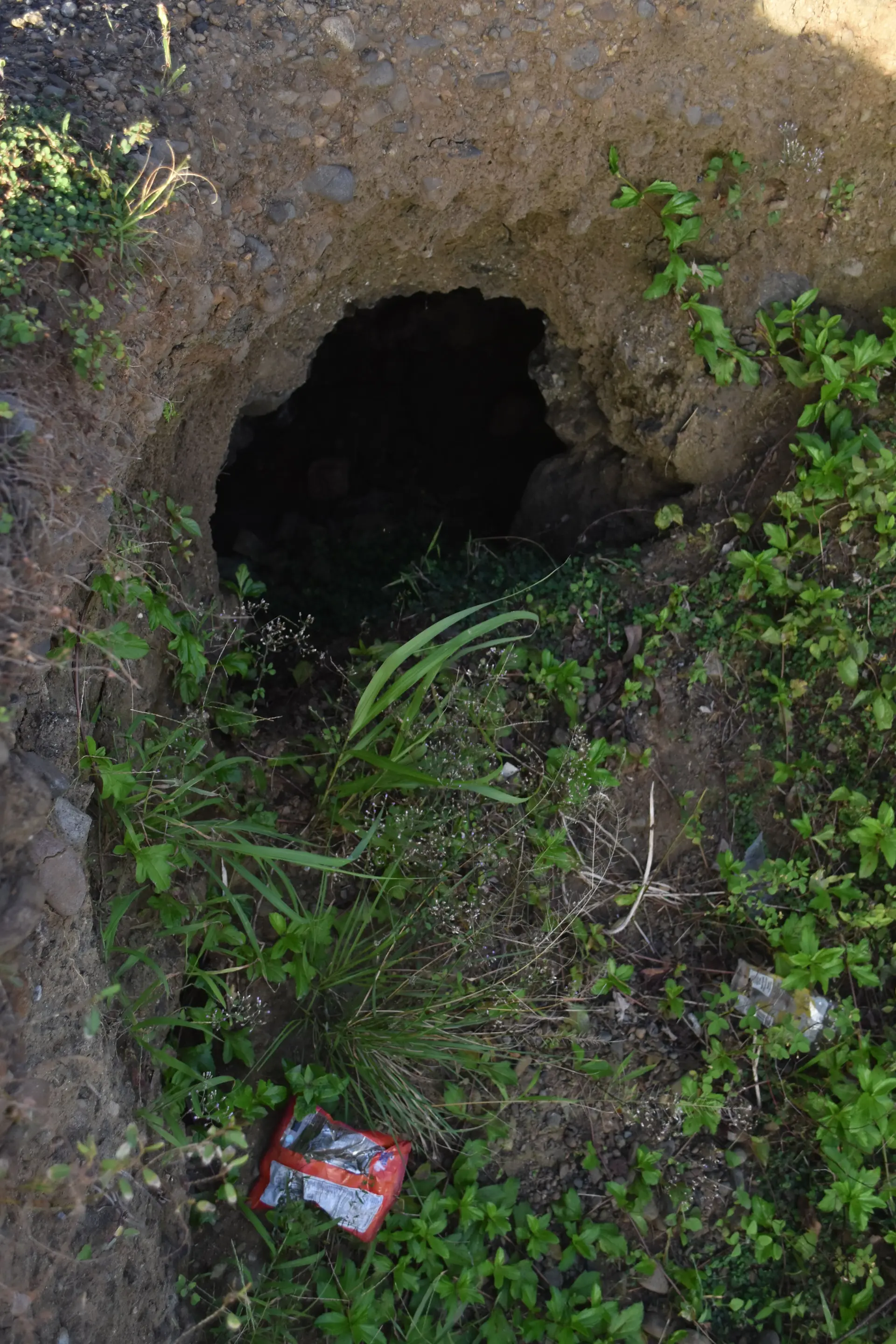 A hole beneath the road caused by coastal waters. Photo: Selita Bolanavanua.