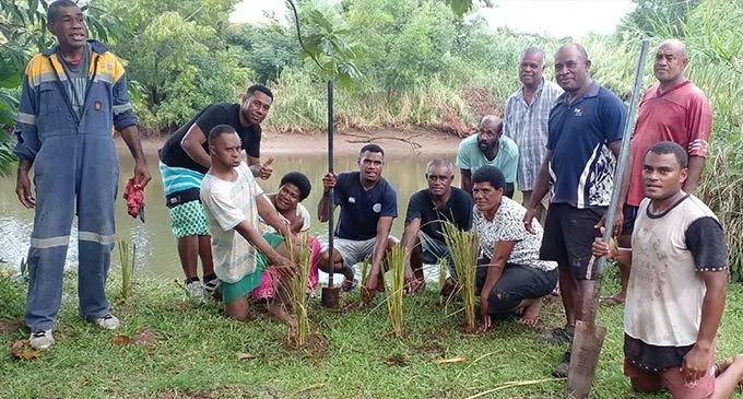 Naviyago villagers plant vertiver grass along the Vitogo river in Lautoka on June 30,2022. Photo: Salote Qalubau
