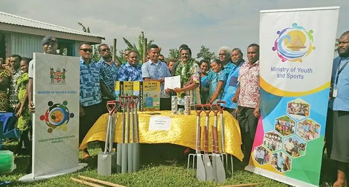 Four youth club members with Minister for Youth and Sports Parveen Bala handover their farming tools to help them generate income in Nativa Village, Ra on Friday 23, 2020. Photo: Susana Hirst-Tuilau
