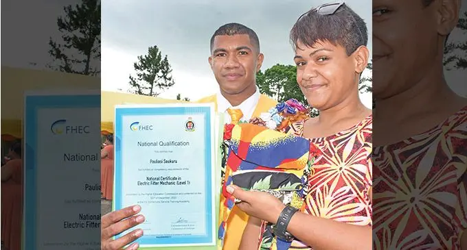 Inmate Pauliasi Saukuru (left) with wife Bolameke Volou following his graduation ceremony as 20 inmates graduated at the Nasinu Vocational Training School on December 2, 2022. Photo: Ronald Kumar