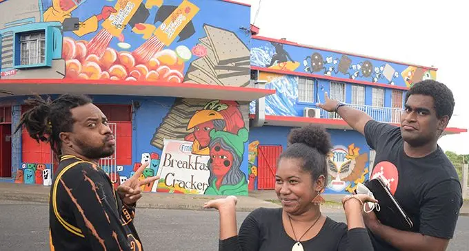 Ghetto Arts artists, (from left) Atueta Rabuka, Vika Satakala and Ratu Naiqama Lalabalavu (Jr.) proudly showing their FMF sponsored mural at the Raiwaqa Top-Shop on  September 28, 2021. Photo: Ronald Kumar