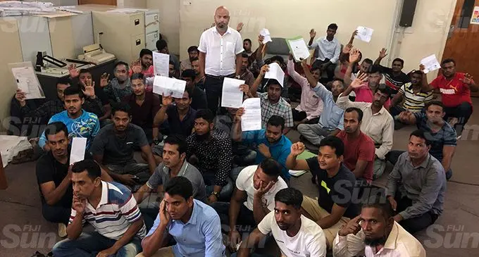 The Director of the Human Rights and Anti-Discrimination Commission Ashwin Raj with the 49 workers from Bangladesh. Photo: Jennis Naidu