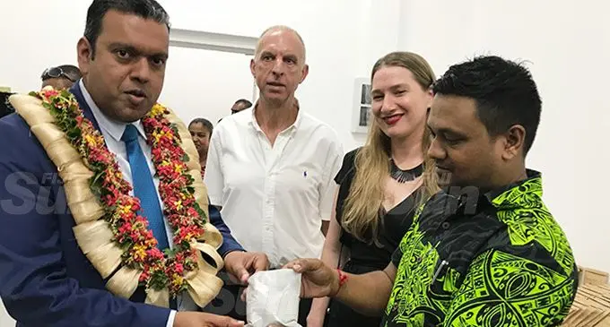 Minister for Lands and Mineral Resources Ashneel Sudhakar with Lion One staff during the Commissioning of the New Lion One Limited Laboratory and Presentation of Navilawa Spl 1512 License on December 13, 2019. Photo: Charles Chambers