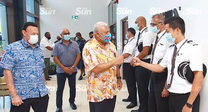 Fiji Airways chief executive officer and managing director, Andre Viljoen with Prime Minister Voreqe Bainimarama greeting Fijj Airways pilots at the Fiji Airways Aviation Academy in Namaka, Nadi, on October 14, 2021. Photo: Leon Lord
