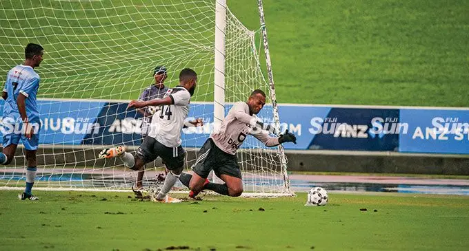 Suva striker Samuela Drudru (14) pressured Tailevu/Naitasiri goalkeeper Simione Tamanisau during their Digicel Premier League clash at the ANZ Stadium, Suva, on March 6, 2022. Photo: Leon Lord