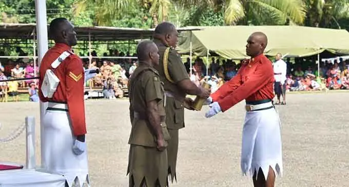 Best all round RFMF recruit, Jovilisi Bob Suka (right), on July 15, 2022, at the Force Training Ground in Nasinu, receives his award from the President, Ratu Wiliame Katonivere. Photo: Wati Talebula-Nuku